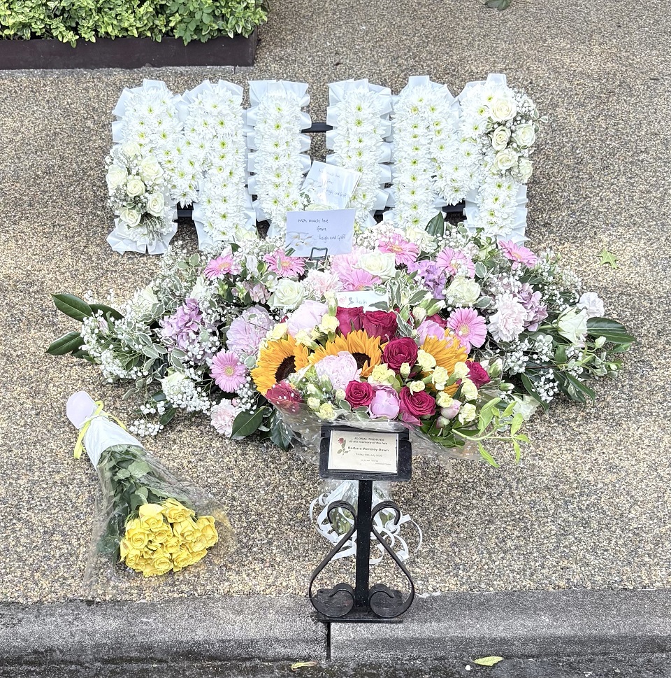 Colourful funeral flower tribute